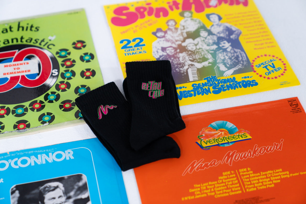 Black Retro Club crew socks with logo flatlay